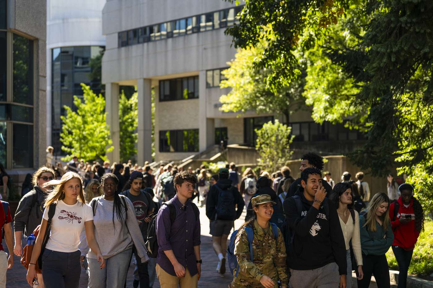 Students walk through Northeastern’s Boston campus during class break