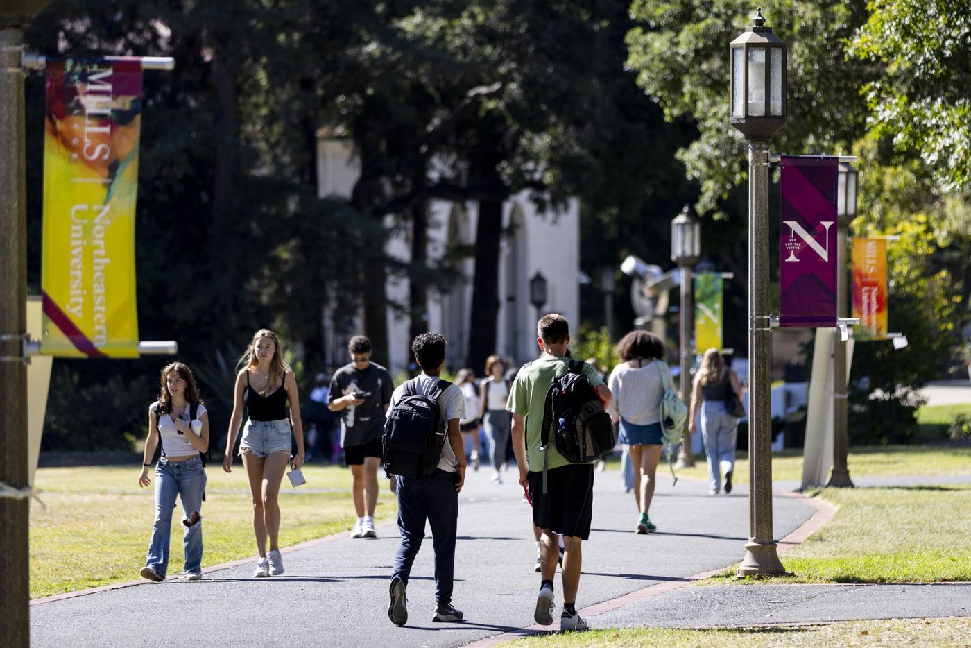 Students walk along path on the Oakland campus