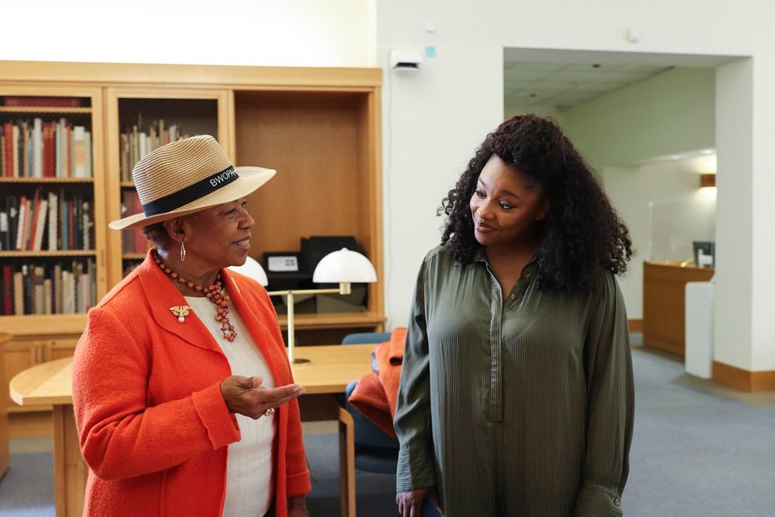 U.S. Rep. Barbara Lee visits with Christina Jackson in the library during a visit to Northeastern’s Oakland campus on May 13, 2024