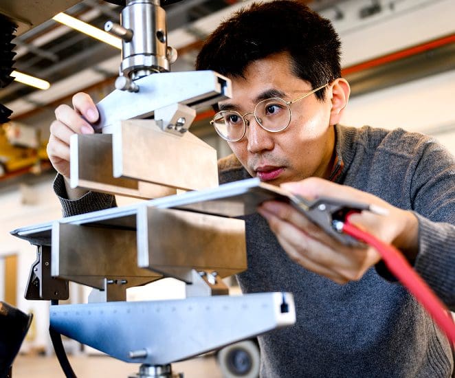 Student works on machinery